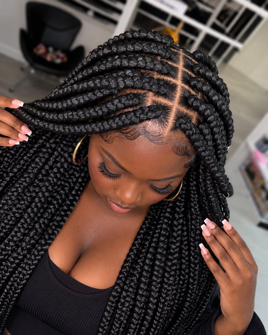 Large black box braids with neat square parts, shown from above
